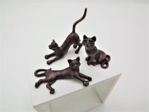 Set of three miniature bronze cats